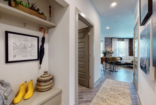 well lit apartment entry hallway