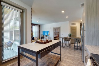 bright kitchen with access to private balcony or patio