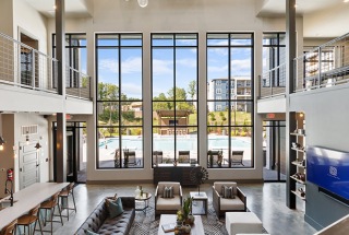 view of lobby from staircase leading up to the 2nd floor