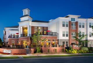 street view of CityPark View exterior lit up at night on corner lot