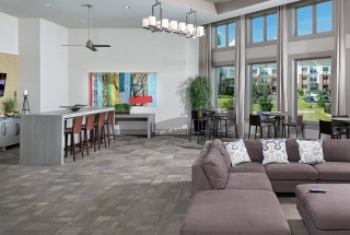 spacious clubhouse with large windows and seating areas