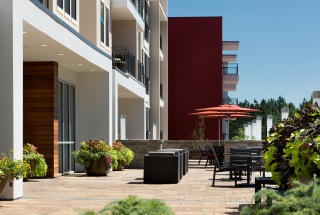 courtyard with umbrella shaded tables and chairs