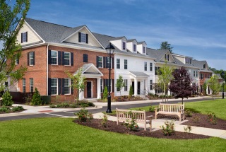 rendering of neighborhood and central lawn with benches